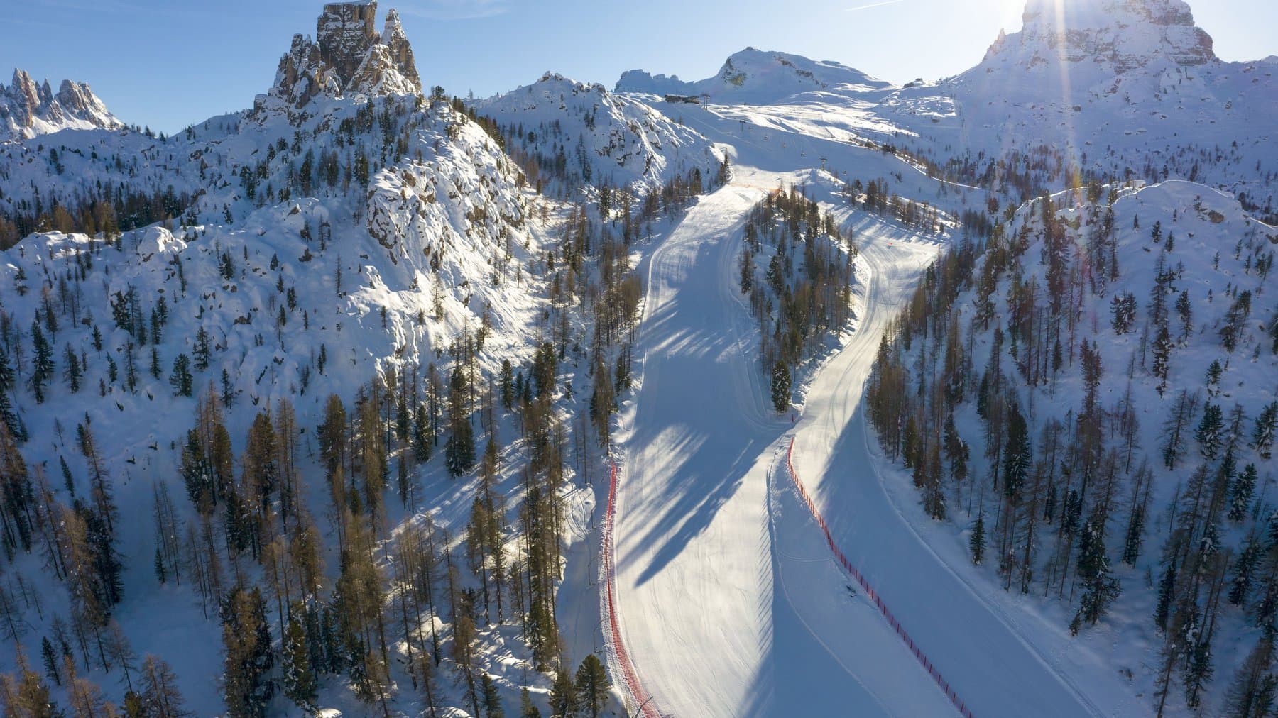 A groomed run through the Dolomite peaks above Cortina, seen from the air